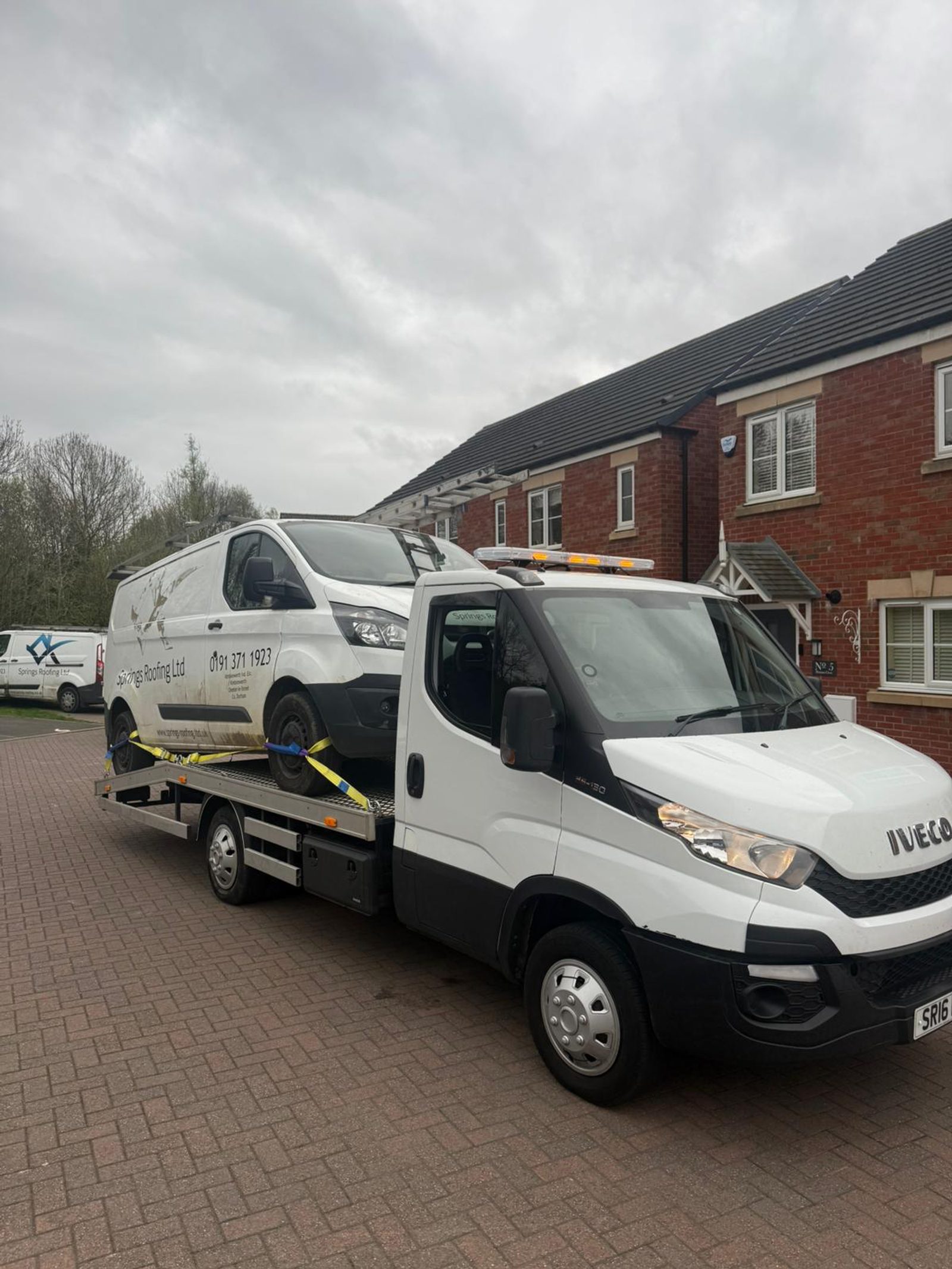 White van being recovered from a residential street